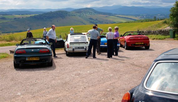 This photo shows a group of members at the car park to the Neil Gunn memorial at Strathpeffer, on part of a Club run around the Black Isle.